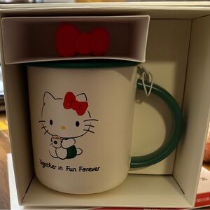Starbucks Hello Kitty Mug with Red Bow and Green Handle
